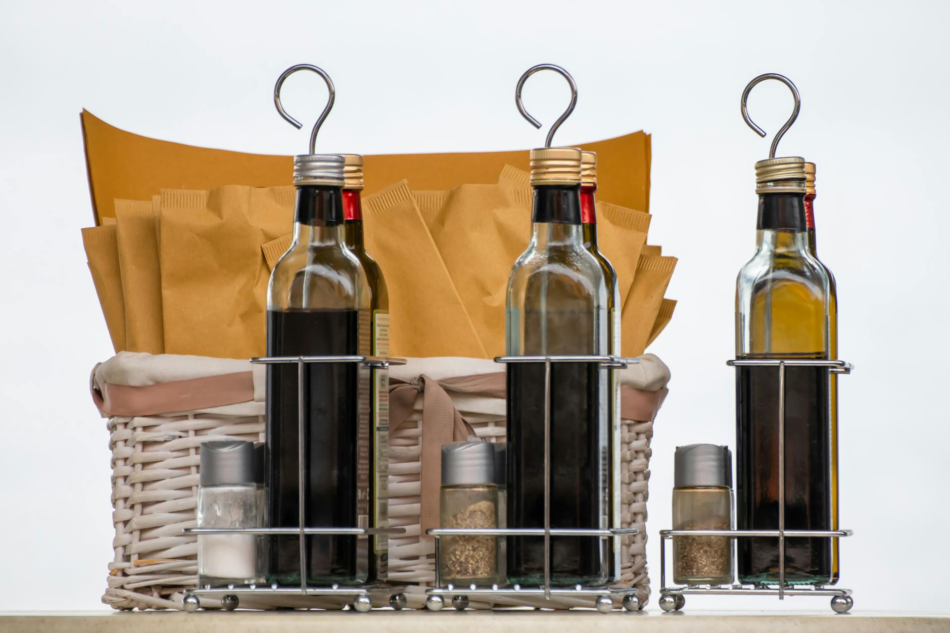 salt pepper and bottles of vinegar and olive oil