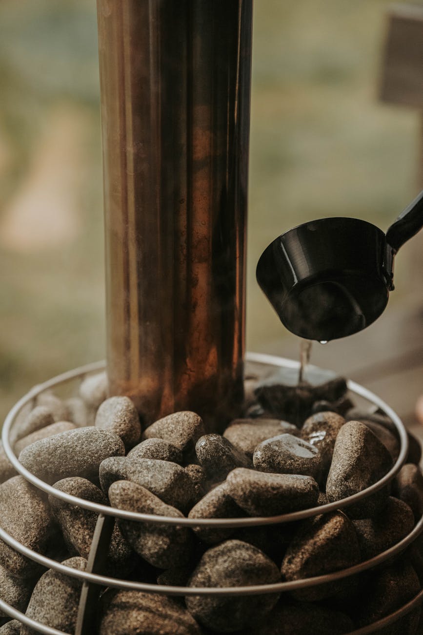 pouring liquid on stones near windows