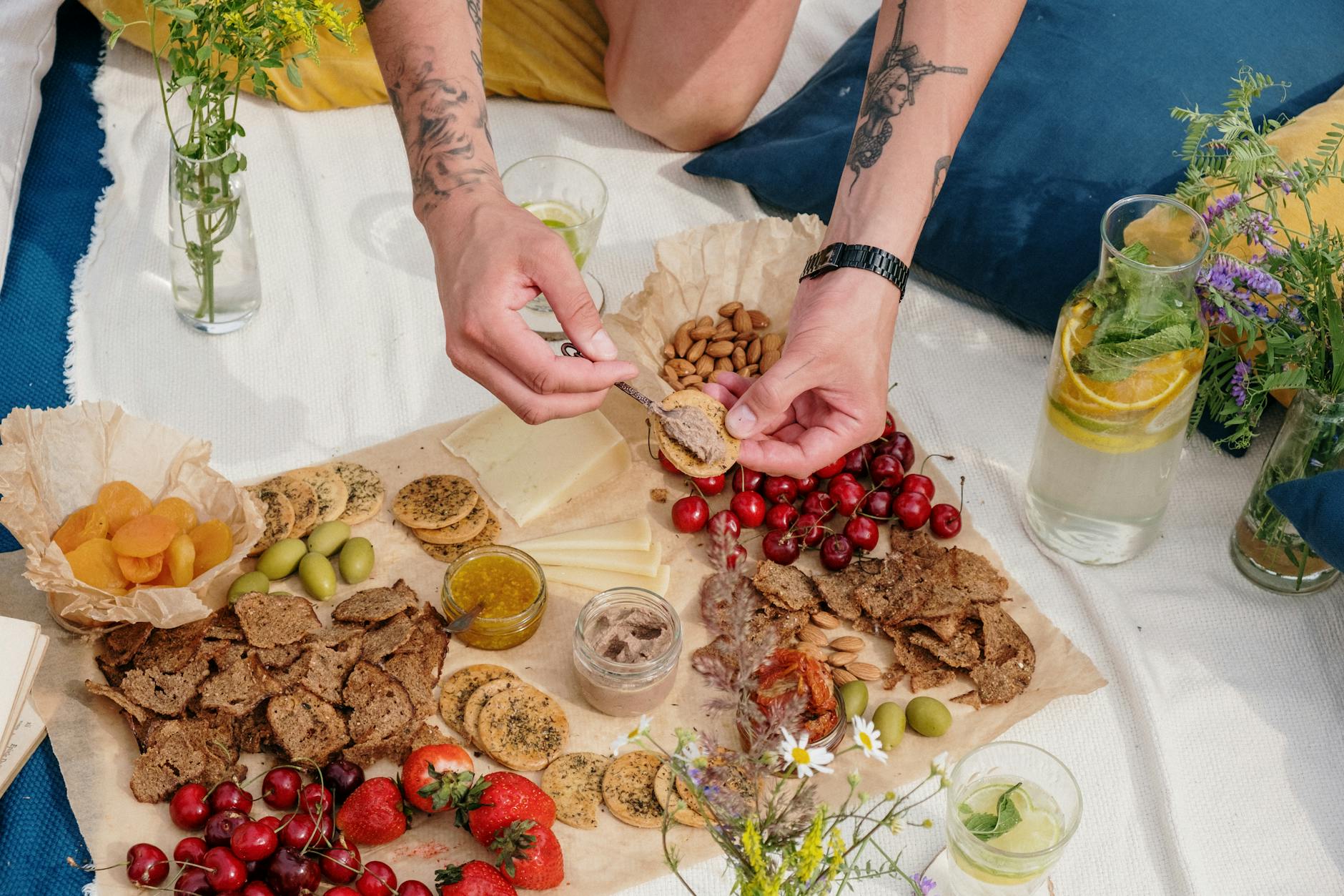 person holding brown wooden tray with foods