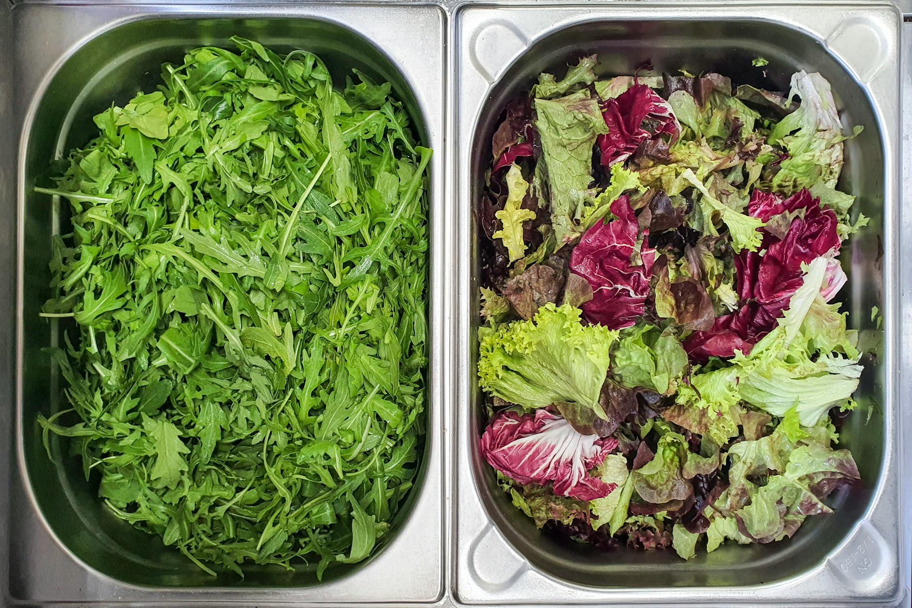 a top view of vegetables in silver trays