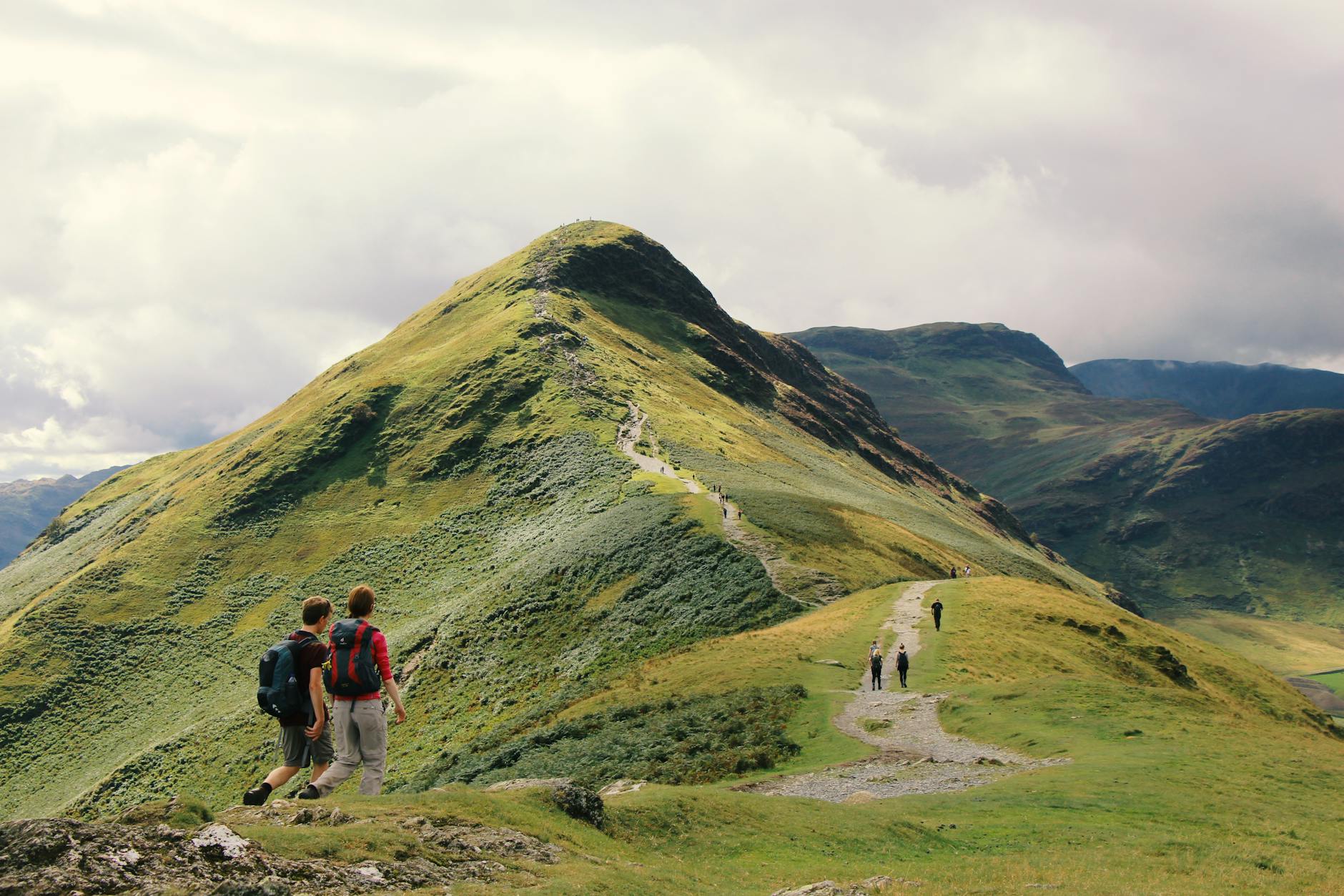 people standing on top of mountain