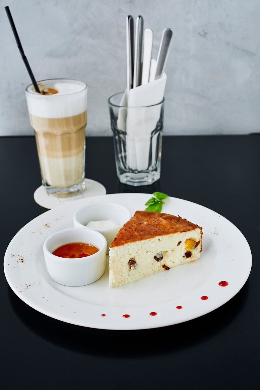 delicious cheesecake and latte in cafe setting