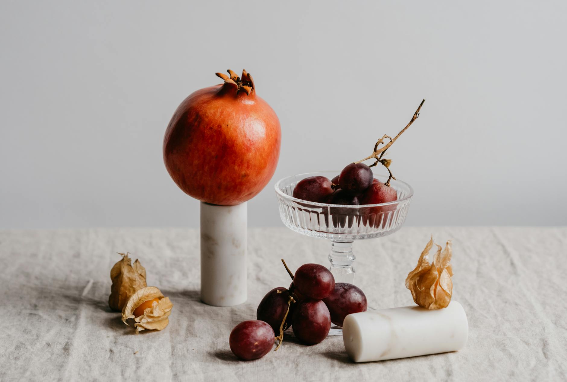 close up shot of an apricot and grapes