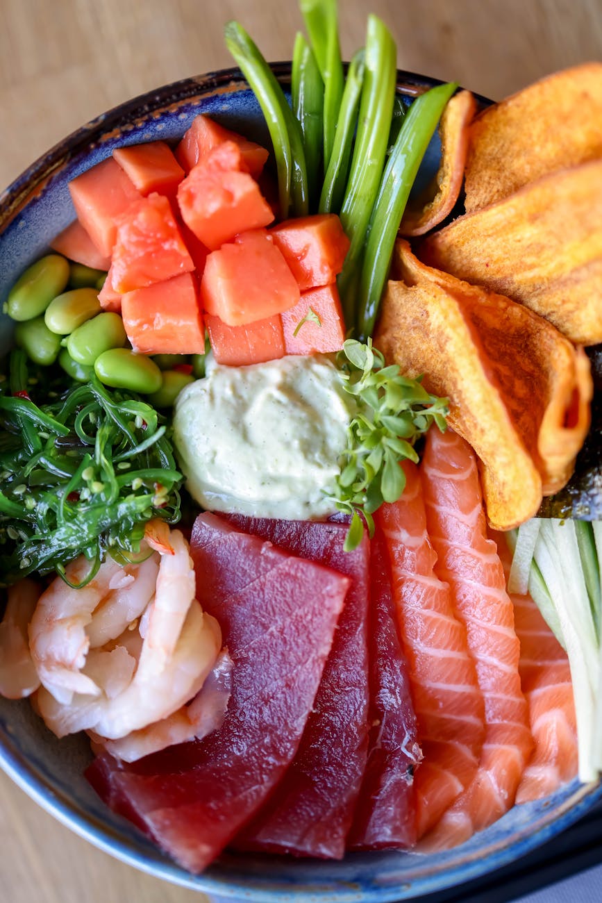 delicious seafood with sauce and herbs in bowl